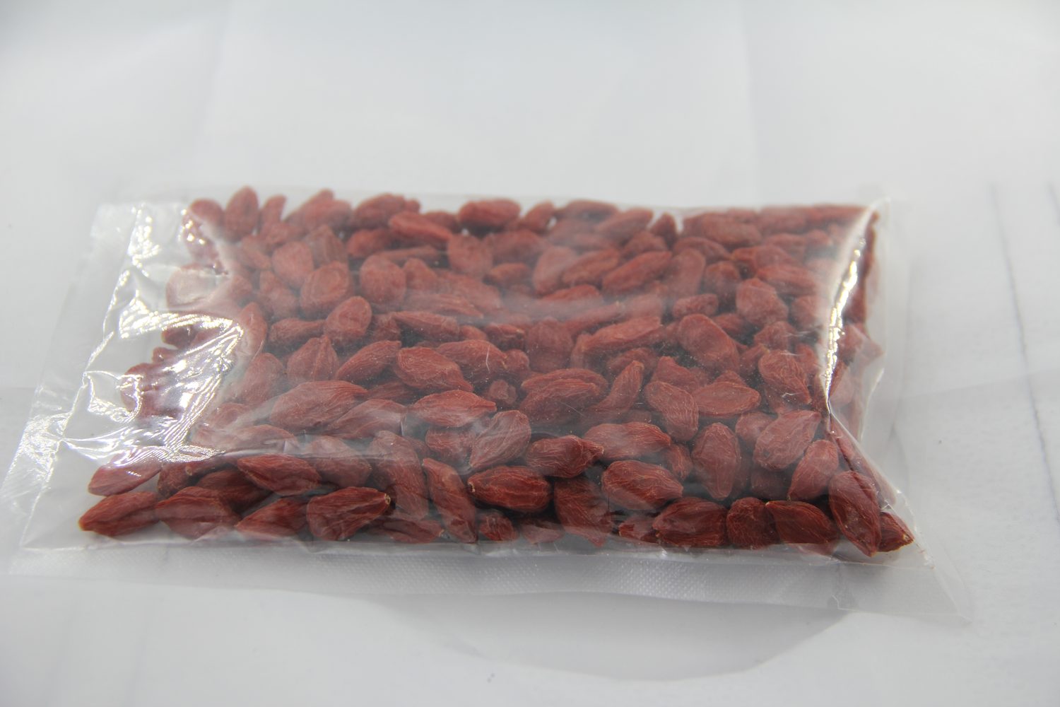 Dried goji berries in vacuum-sealed export packaging