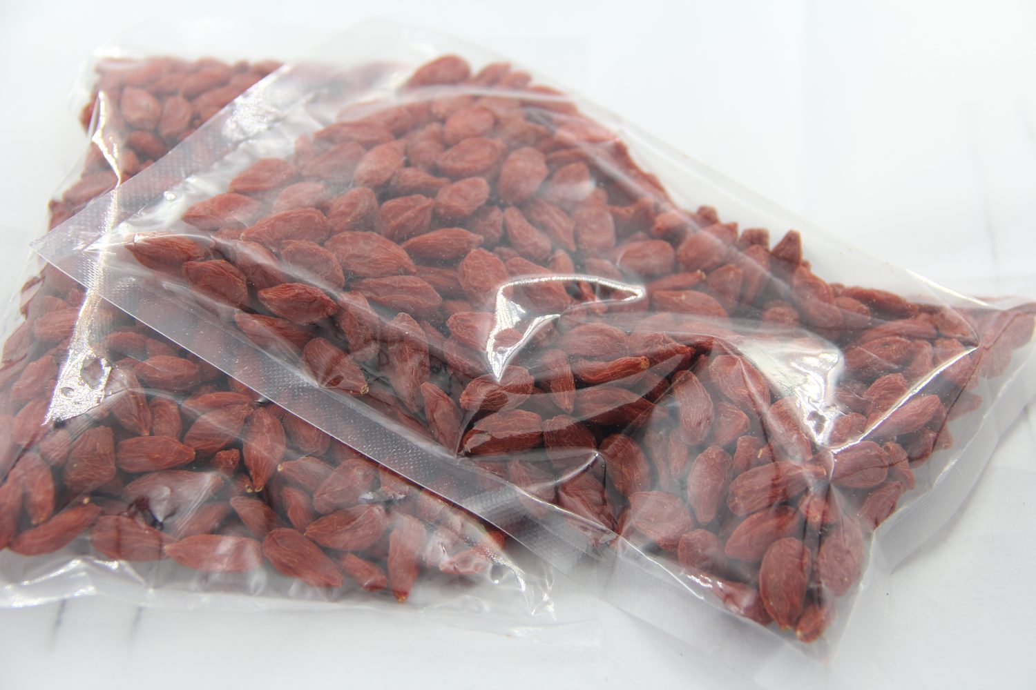 Close view of dried goji berries in vacuum-sealed pack